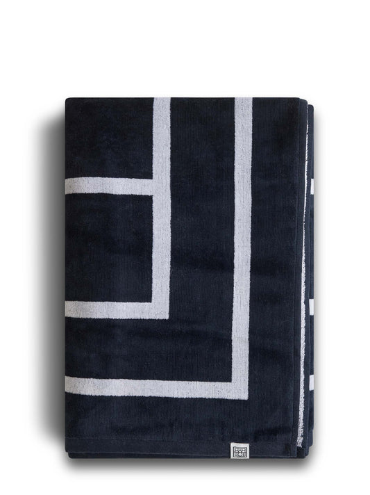 Telo mare in cotone organico blu con monogramma