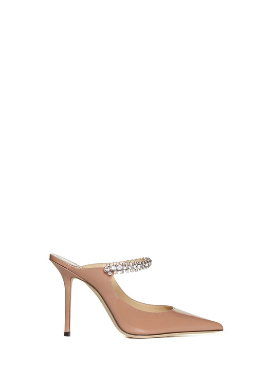 Pastel pink patent leather mules with crystal strap