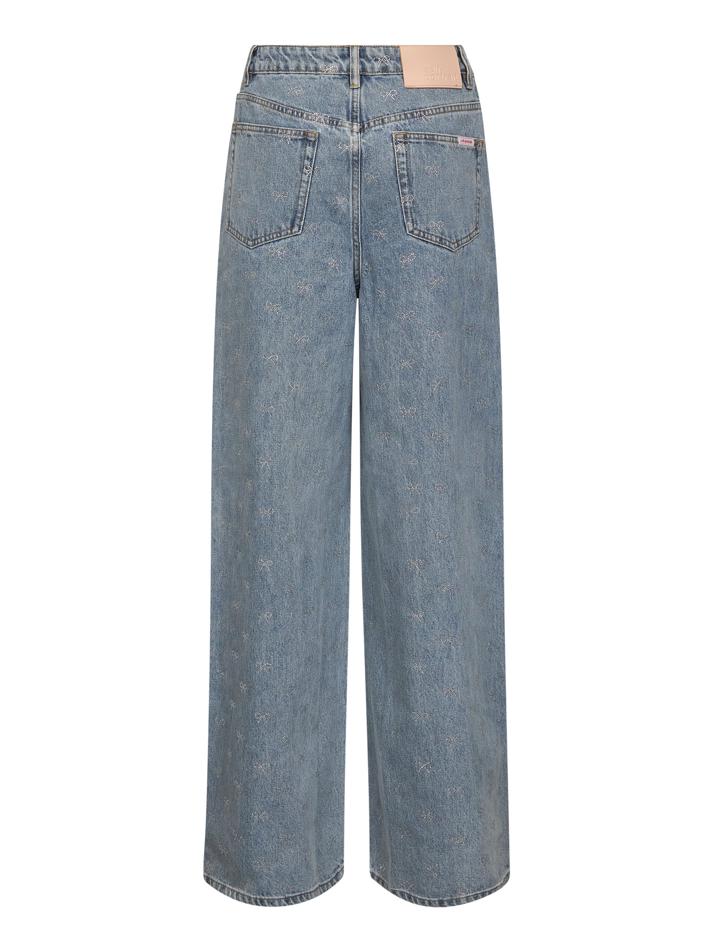 Jeans in denim azzurro con fiocchi in cristalli