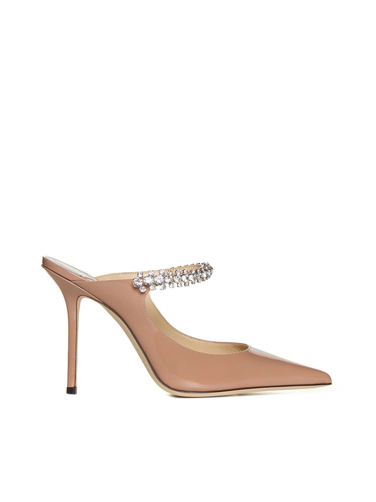 Pastel pink patent leather mules with crystal strap