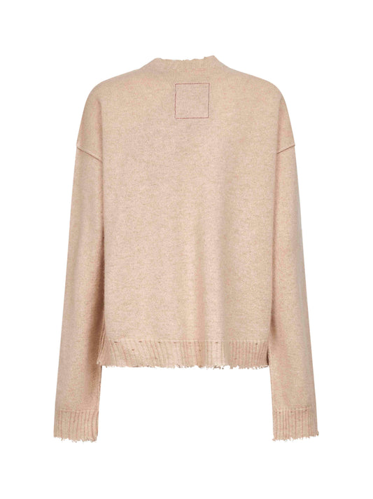 Beige cashmere sweater with distressed details