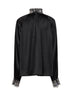 Blusa arricciata in raso di misto seta nero con ricami