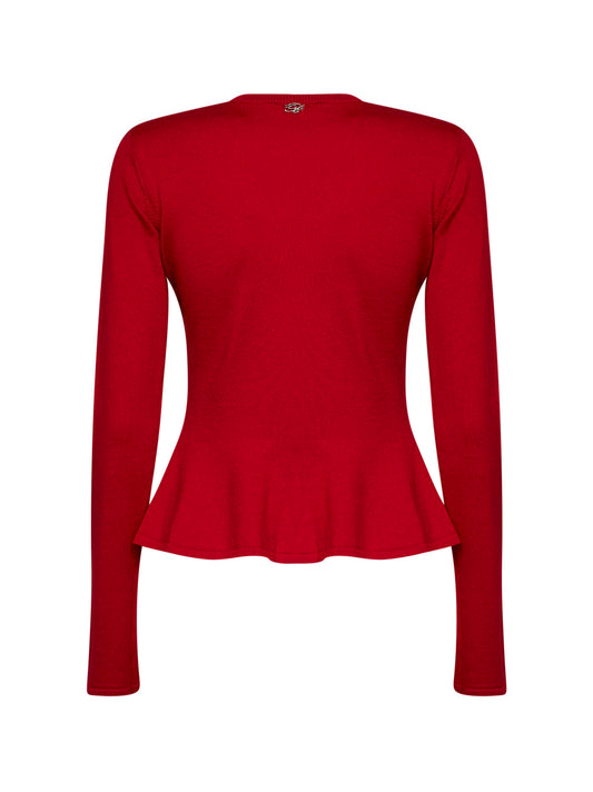 Red wool knit sweater with patent leather rose brooch
