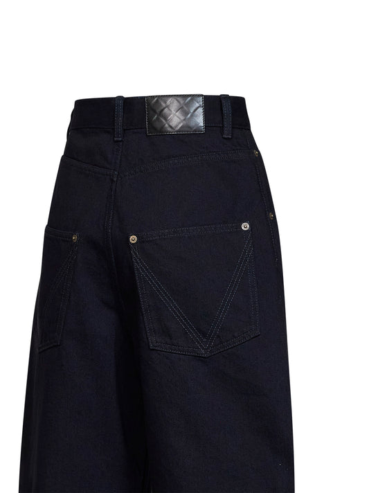 Dark indigo cotton denim curved leg jeans