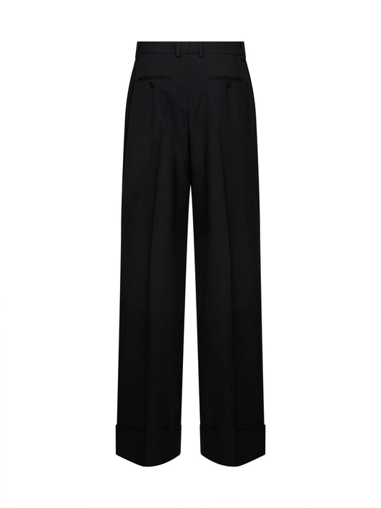 Black virgin wool trousers with turn-up hems