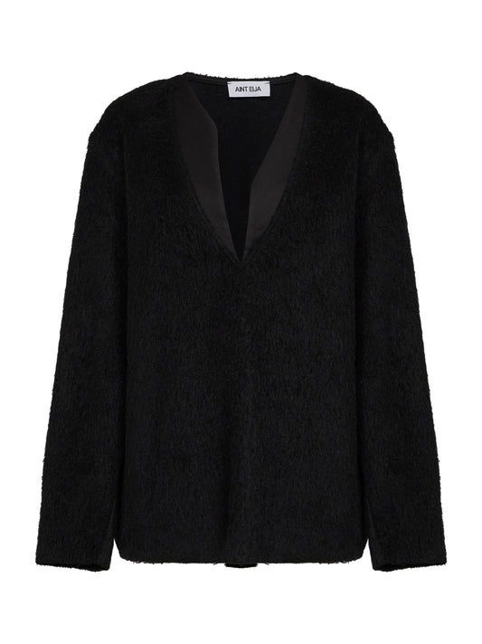 Black fleece sweater with asymmetric neckline