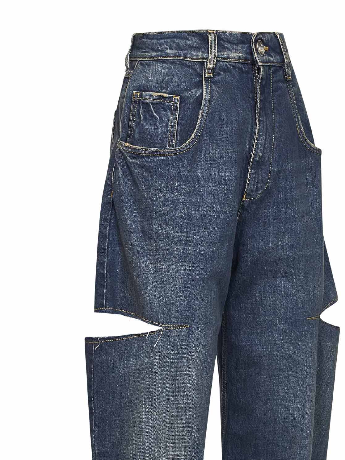 Washed indigo denim slash details jeans