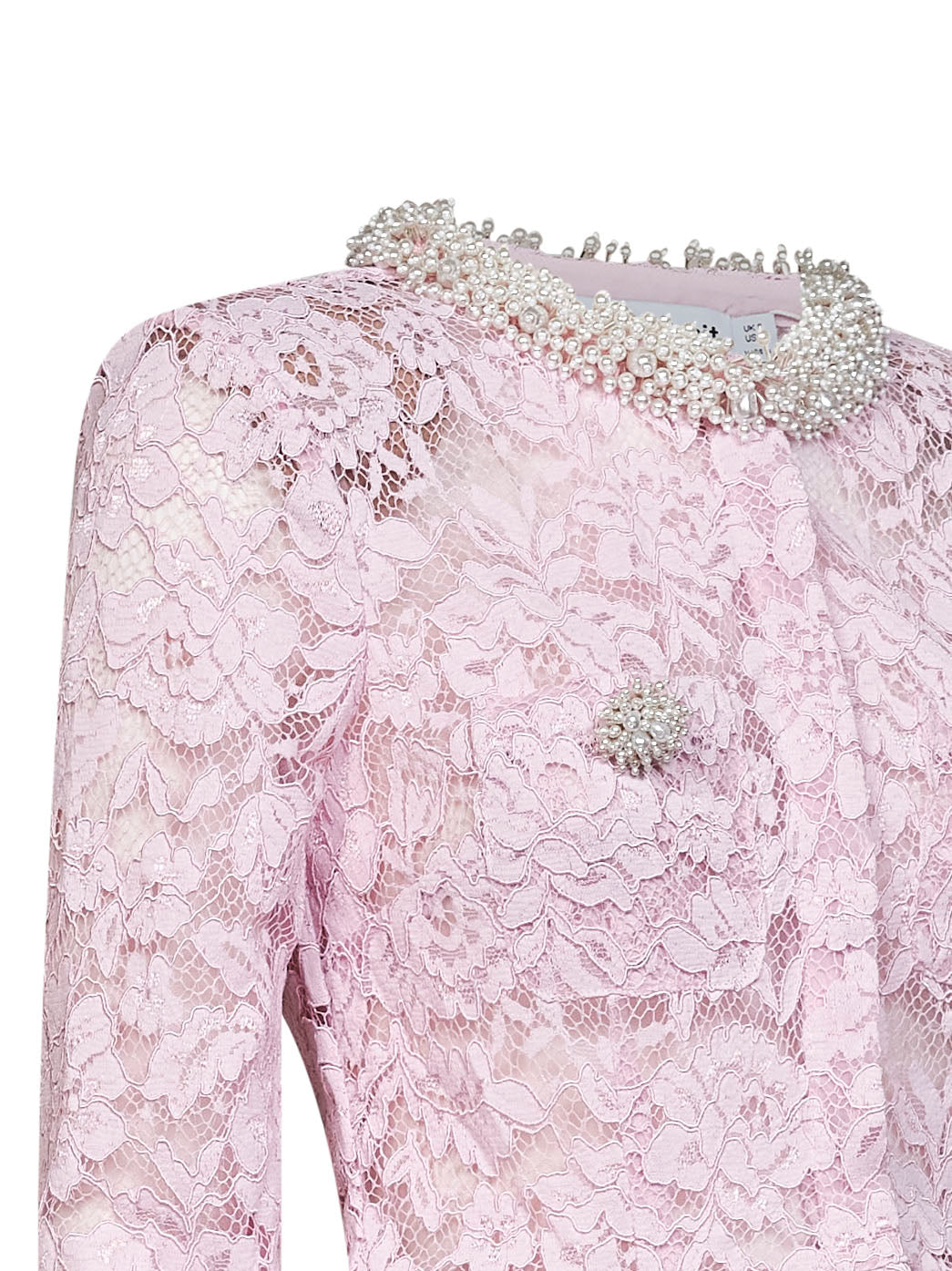 Top in pizzo rosa con orlo a peplo