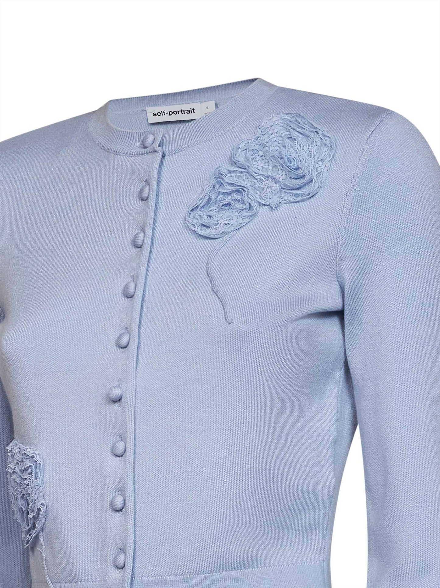 Cardigan in maglia blu con dettaglio fiori
