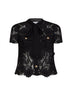 Top in pizzo macramè nero con collo annodabile