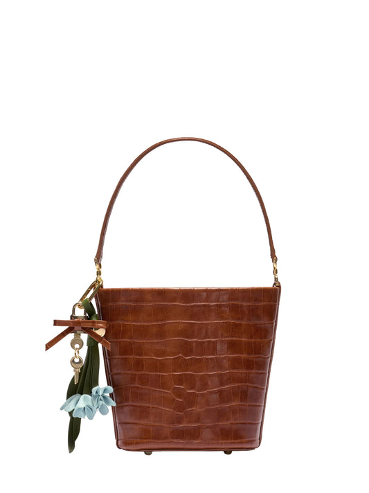 Brown bucket bag with charms