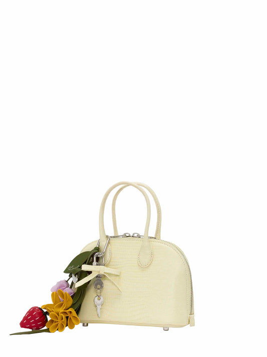 Mini bag con tracolla e ciondoli gialla