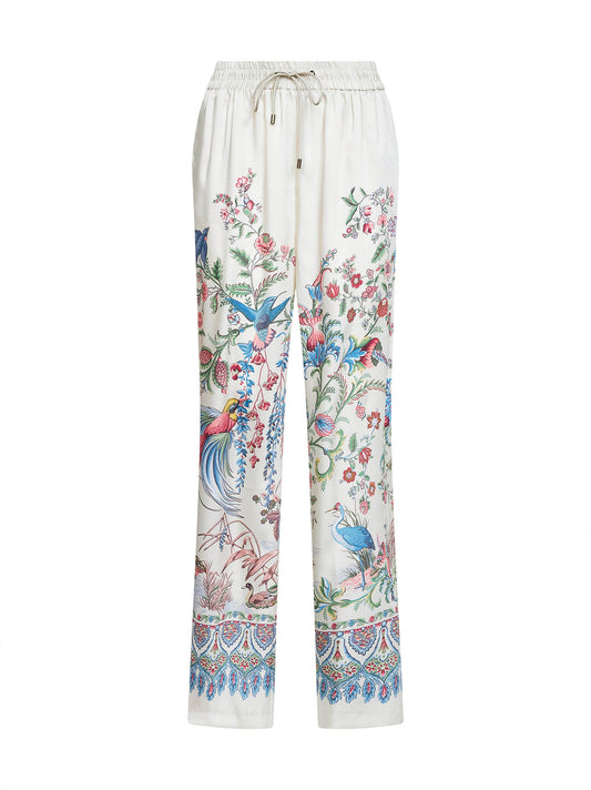 Pantaloni ampi in twill bianco con stampa flora e fauna