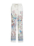 Pantaloni ampi in twill bianco con stampa flora e fauna