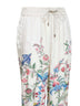 Pantaloni ampi in twill bianco con stampa flora e fauna