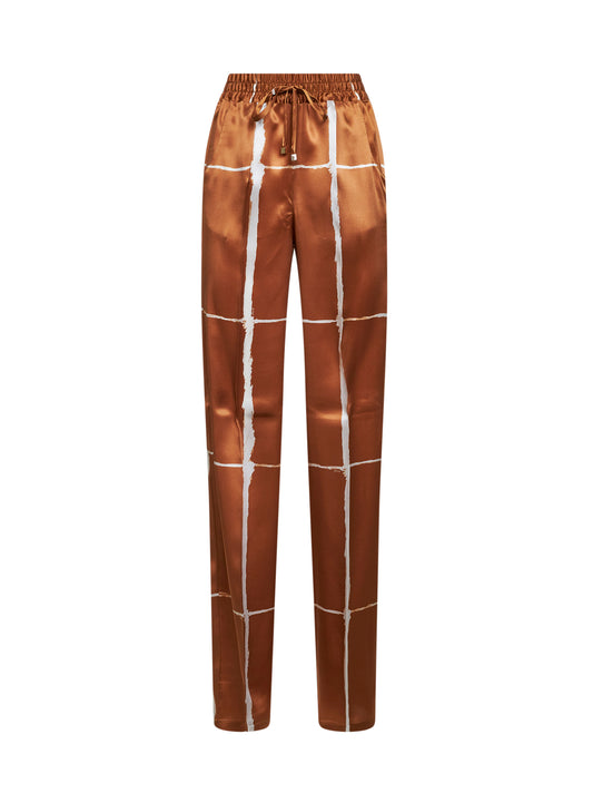 Tan and white printed silk drawstring trousers