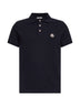 Polo in piquet di cotone blu con patch logato