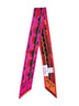 Bandeau in twill di seta fucsia e arancione con mix di stampe