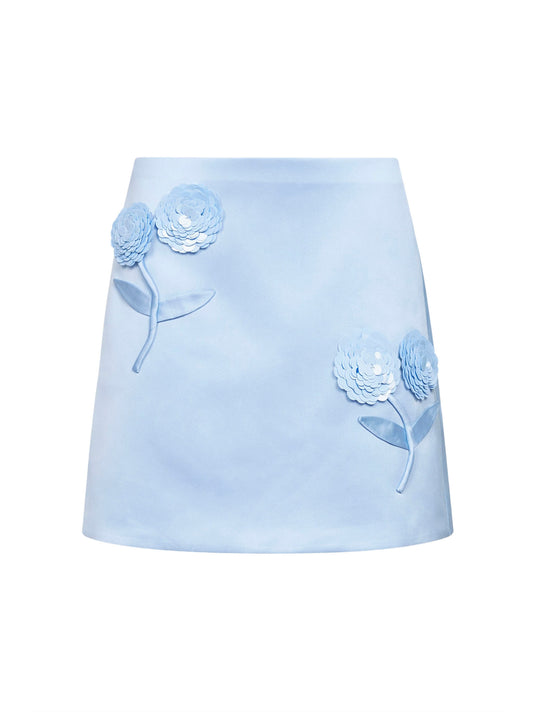 Minigonna in raso azzurro con fiori 3D in paillettes