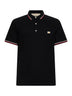 Polo in piquet di cotone nero con Vlogo patch